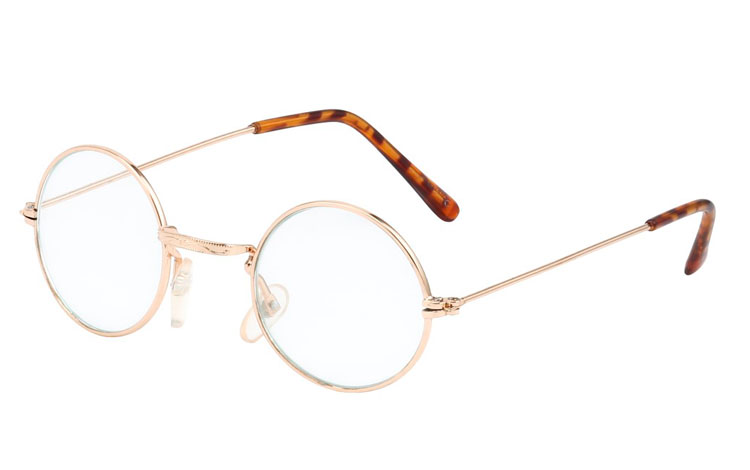 Rund brille i guldfarvet metalstel. Let og elegant design. Denne brille er den mindre model af de runde briller uden styrke. | populaere_solbriller